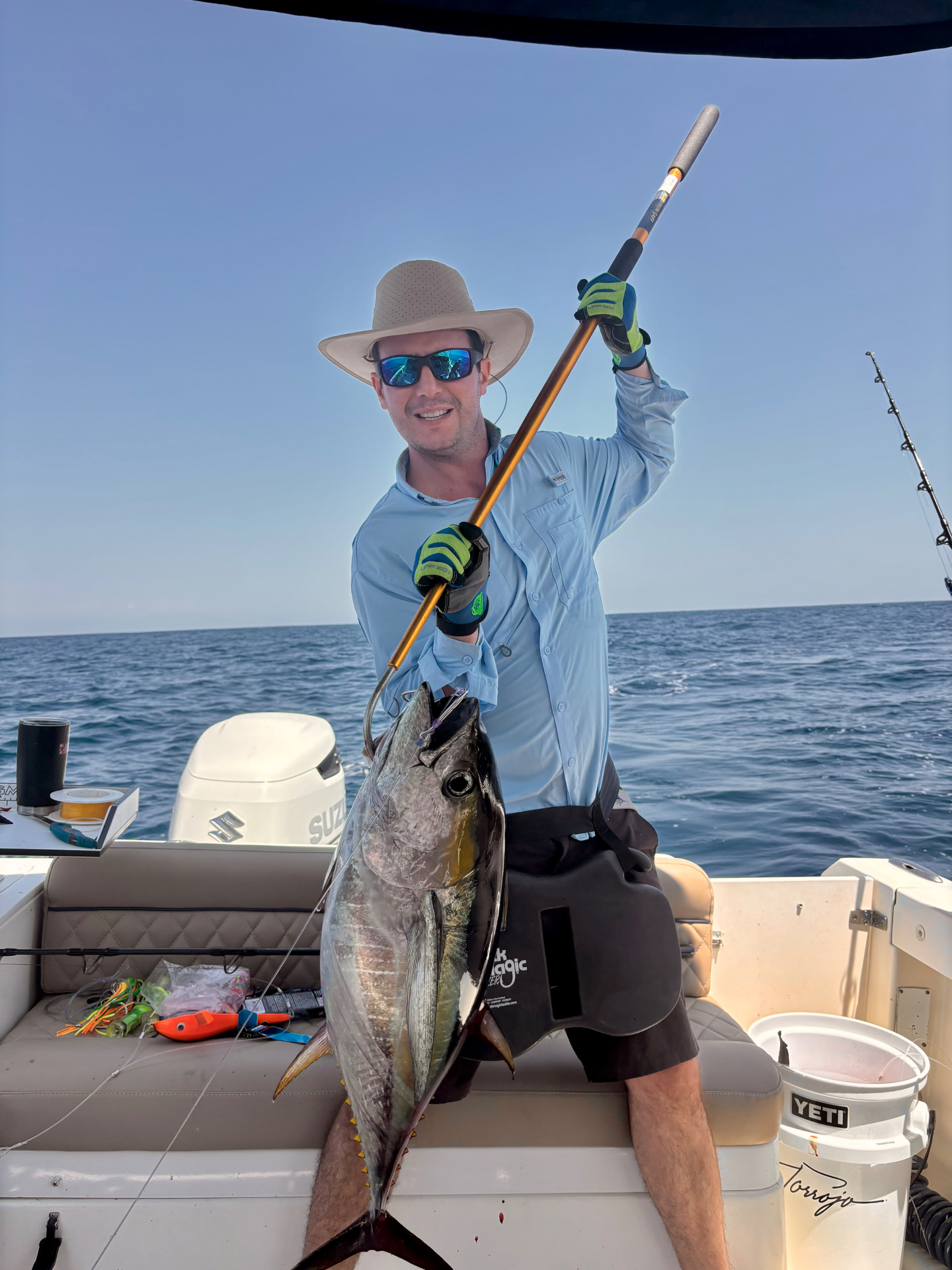 Angler gaffing a yellowfin tuna