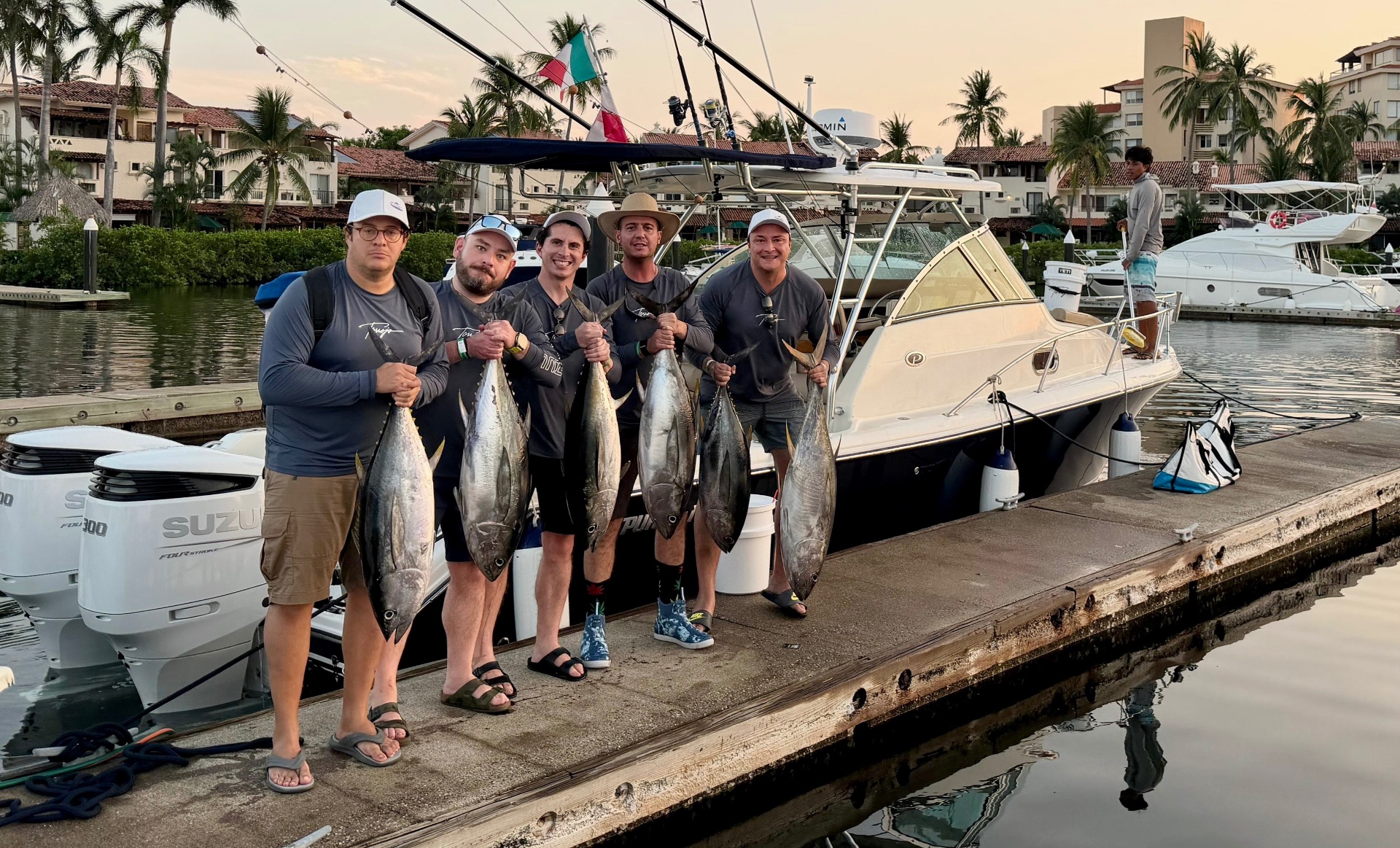Crew with a haul of yellowfin tuna at the marina