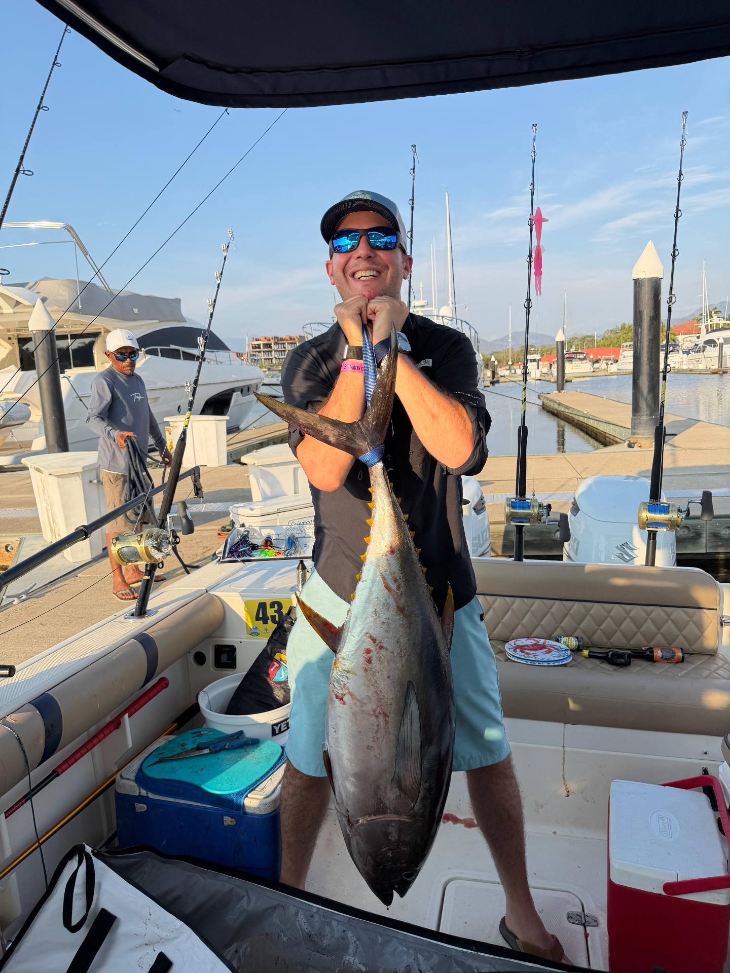 Angler with a large yellowfin at the marina