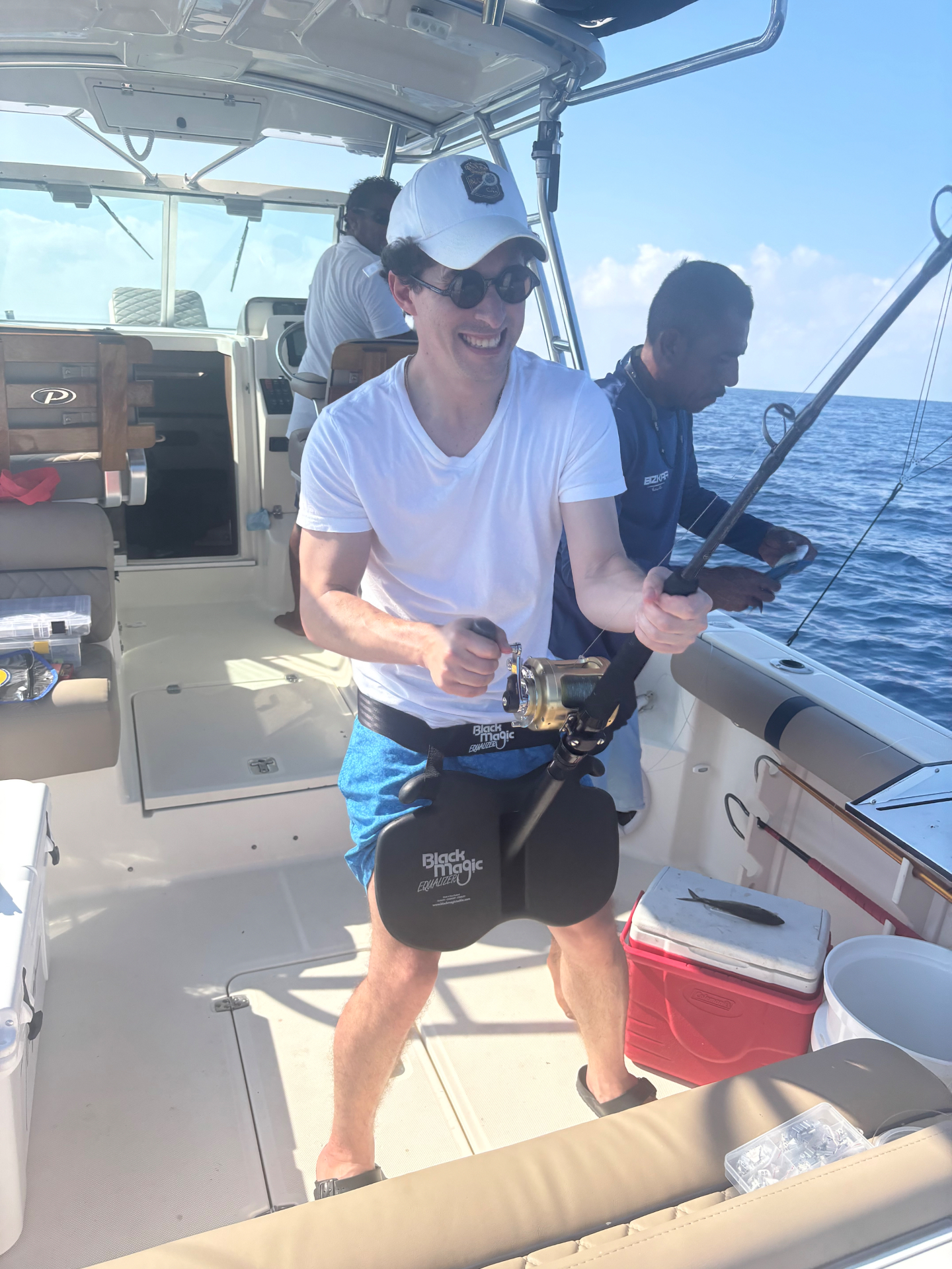 Angler working the reel with a fighting belt