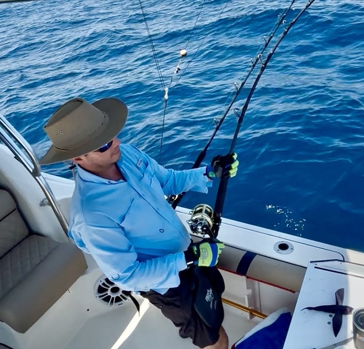 Angler working a bent rod on the Torrojo charter boat